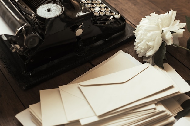 Old black typewriter with paper worth on the table