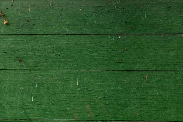 Old boards painted green red. Background texture