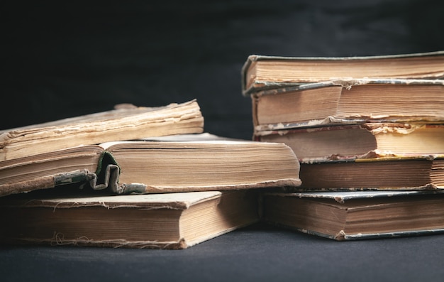 Old books on the black background.