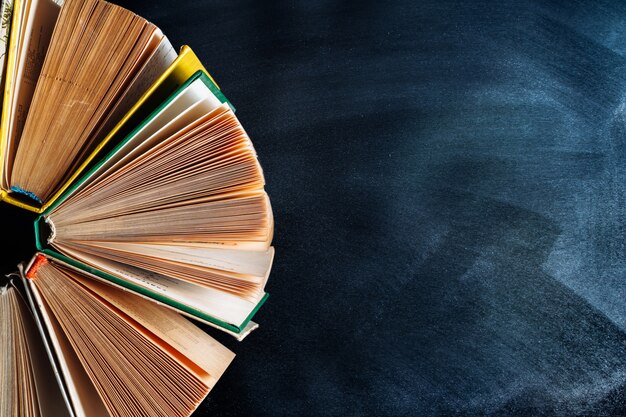 Old books on black background