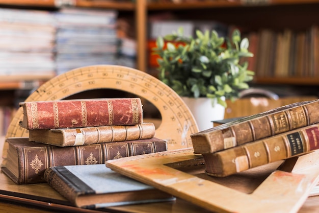 Photo old books near protractor and triangle