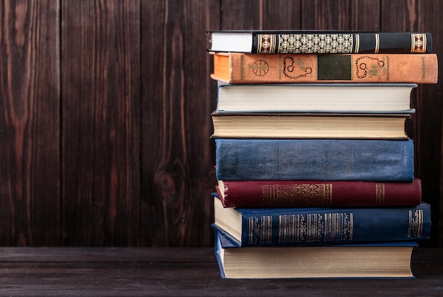 Old books on wooden table. The source of information