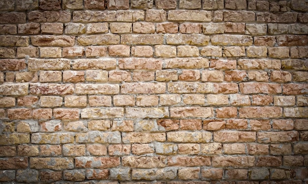 Old brick wall with white paint background texture close up