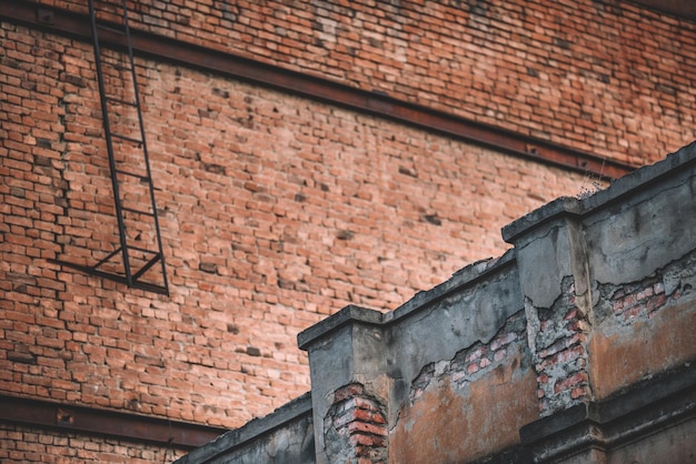 Old Brick Walls And A Ladder To The Roof