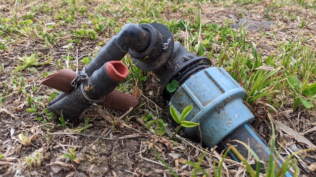 Old broken plastic pieces of tubes and fittings from the park's irrigation system