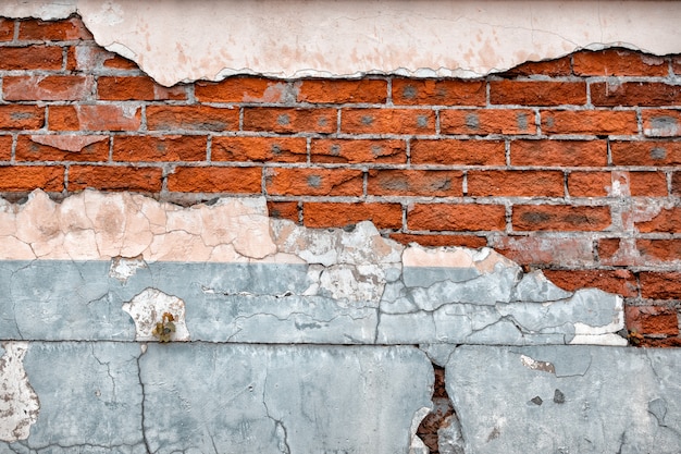 Old broken wall with visible bricks texture