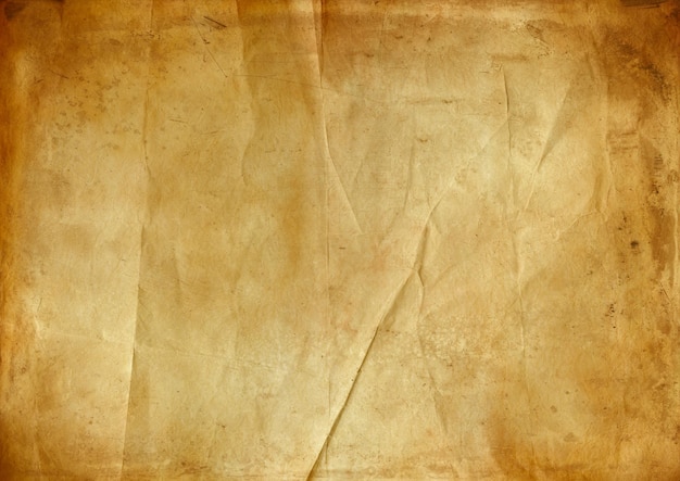 Old brown crumpled paper texture background. Vintage wallpaper