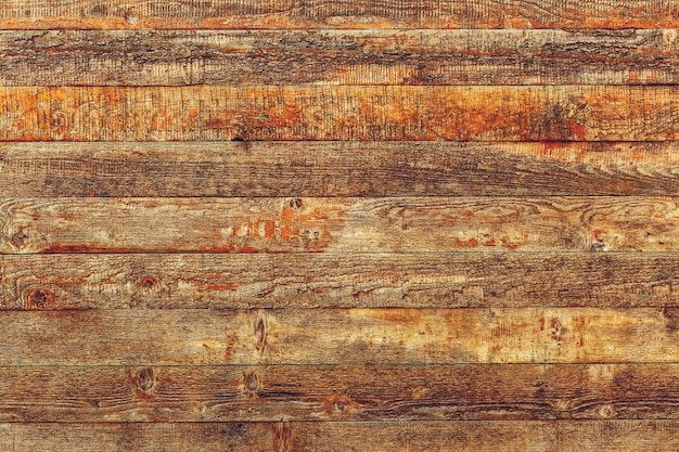 Old brown wooden planks with cracked color paint