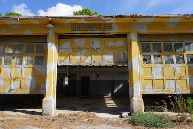 An old building with the word autocares on it