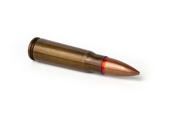 Old bullet for an automatic rifle 762 on a white background Selective focus