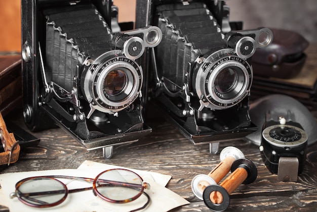 Old camera on an old background on a close-up table