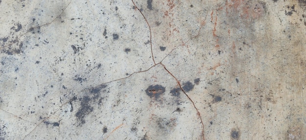 Old cement full of stains and scratches can be used as a background