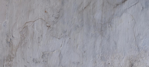 Old cement full of stains and scratches can be used as a background