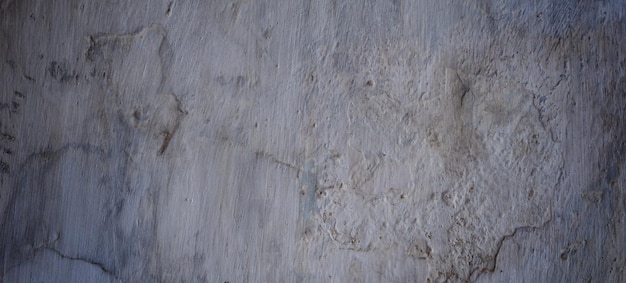 Old cement full of stains and scratches can be used as a background