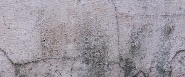 Old cement full of stains and scratches can be used as a background