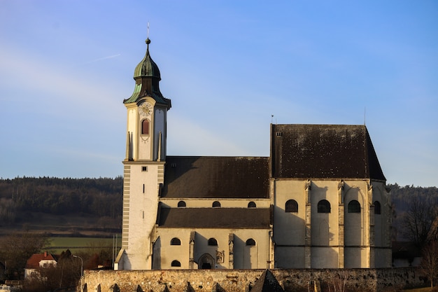 Old church on top of a hill behind the mountains of a small town in Austria, Melk.