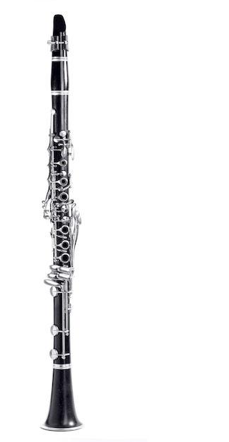 Old clarinet body with the silver mechanisms on the black wood white background and free space for text