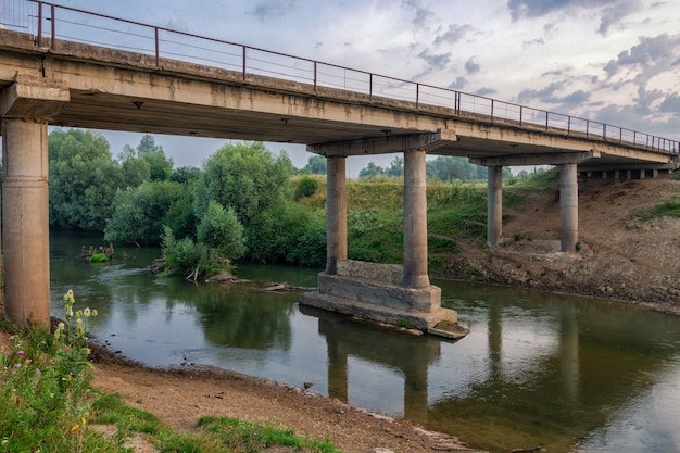 Old concrete bridge across the river