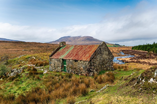 An old cottage with a rusty roof