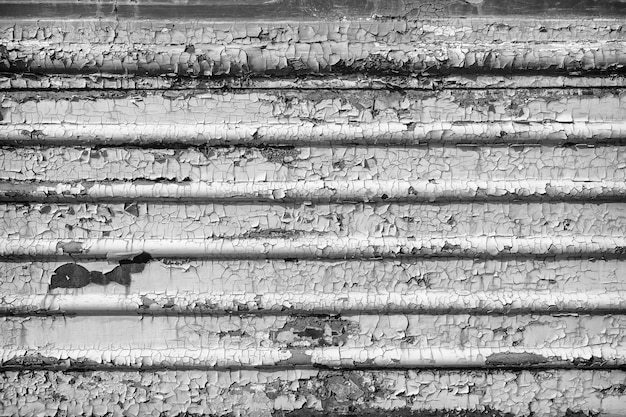 Old cracked rusty paint  background texture close-up black and white