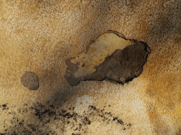 Old cracked weathered plastered brick wall background texture Dirty peeled plaster wall with falling off flakes of paint