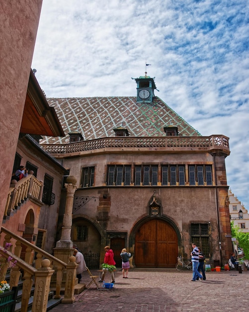 Old custom house or Koifhus at Ancienne Douane Square in the Old city center of Colmar, Haut Rhin in Alsace, of France. People on the background