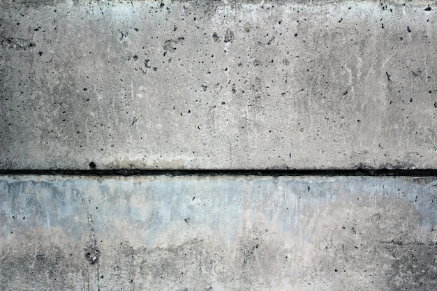 Old dark grey concrete wall. Grunge background