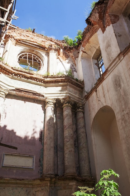 Old destroyed church Ruins of catholic Church Old dilapidated building with red brick columns Historical value 18th century Lyskovo Belarus