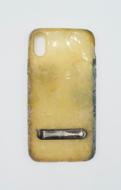 Old and dirty silicon phone case due to yellow stains and mold