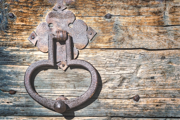 An old door with an iron handle