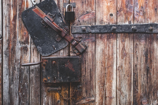 Old door wood texture metal latch lock