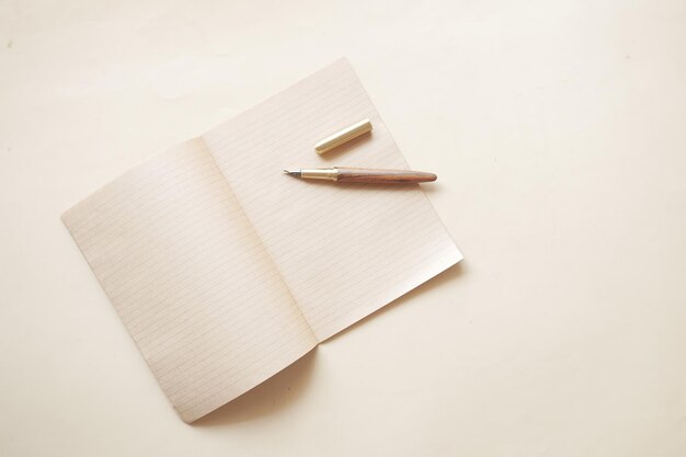 Old empty paper and fountain pen on table