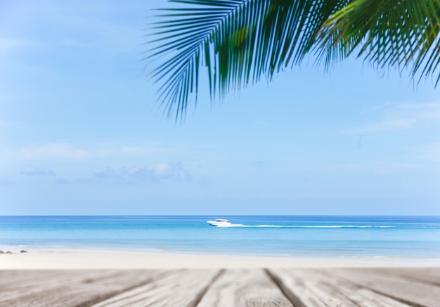 Old empty wooden pier perspective with sandy beach.Sand beach and Beautiful sea background in summer.