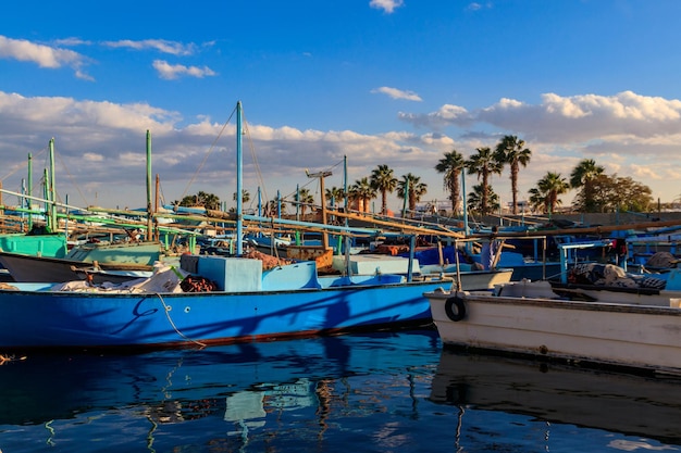 Old fishing boats in the sea harbor of Hurghada Egypt