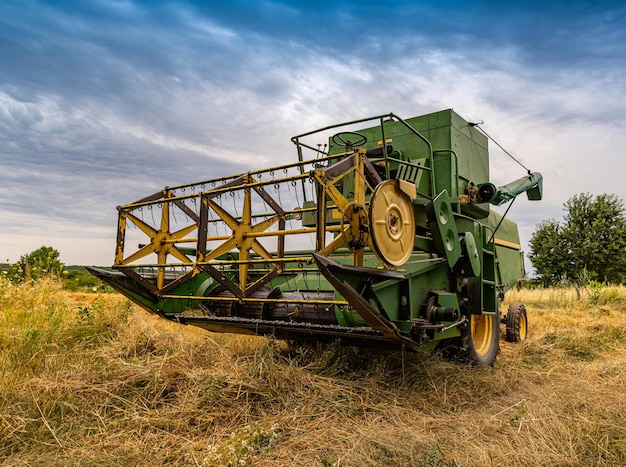 Old green combine harvester