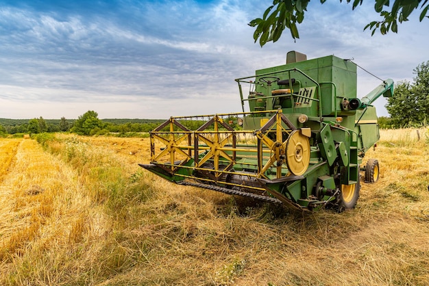 Old green combine harvester