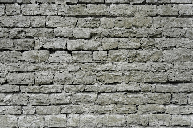 Old grey stone wall background texture