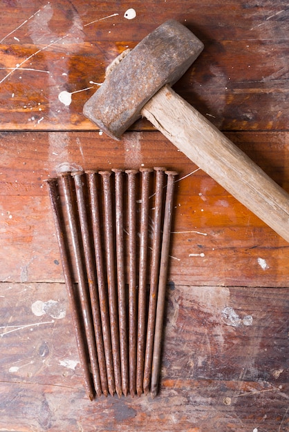 Old hammer with rusty nails