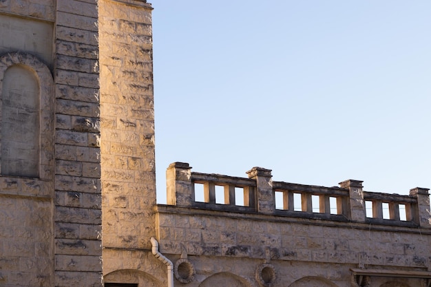 Old historical buildings Stone ancient walls with blue sky background Tourism concept