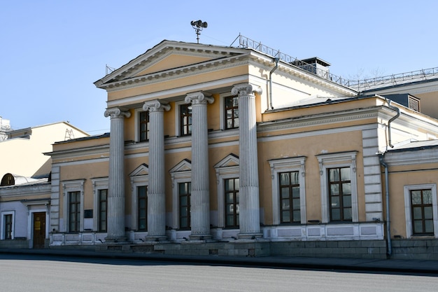 Old house with columns on Borovitskaya street in Moscow Stone house yellow March 24 2022 Moscow Russia