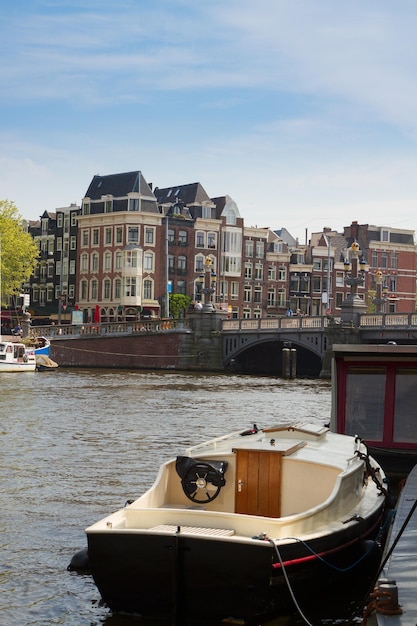 Old houses of  Amsterdam on Amstel river, Netherlands