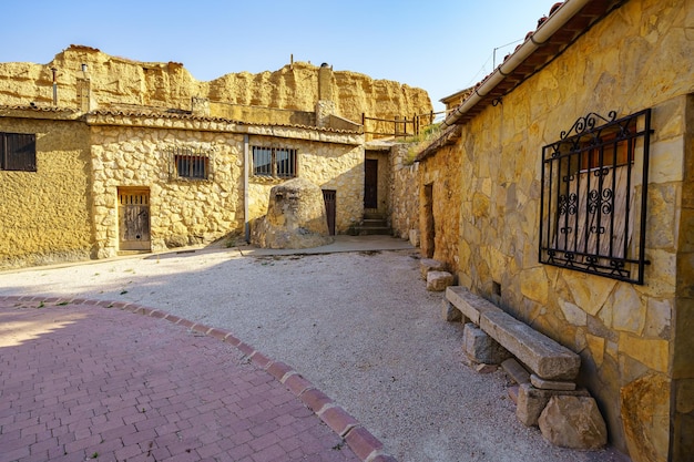 Old houses built next to the rocks of the mountains in San Esteban de Gormaz Spain