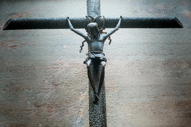 Old iron cross with Jesus crucified Jesus on the cross