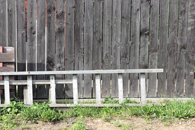 Old ladder near a fence