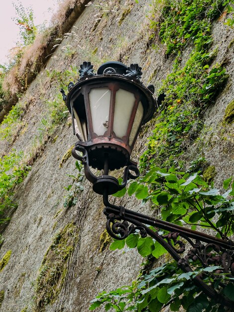 Old lantern against the background of the old wall of the petrovaradin fortress