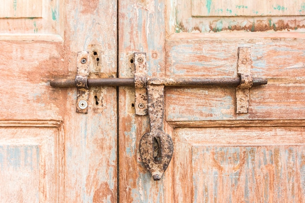 Old latch on a wooden door