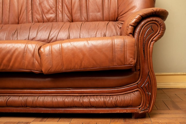 Old leather sofa in an old room