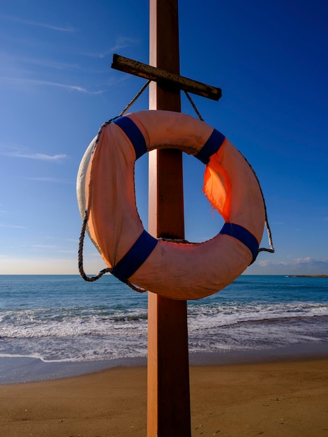 An old lifebuoy on the beach