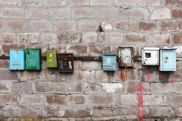 Old mailboxes on an old dirty wall