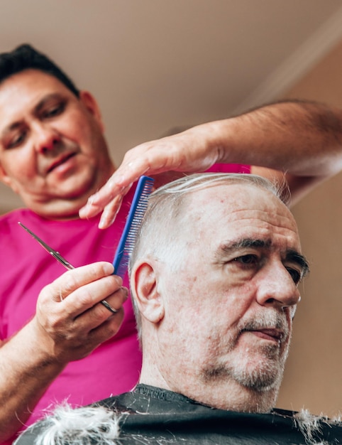 Old man getting a haircut